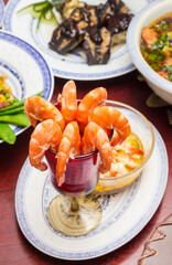 Glass filled with cooked shrimp