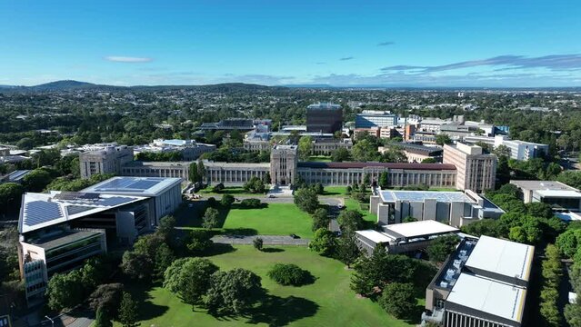Drone shot of University of Queensland UQ St Lucia, drone orbiting UQ's Great Court and Forgan Smith Building. Shot during day time with clear blue skies. Brisbane QLD University 4K