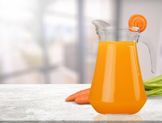 Fresh healthy Carrot juice and vegetables on the desk