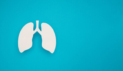 A lung symbol on a blue background with space for text