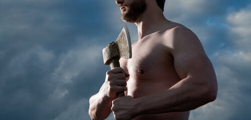 shirtless man with axe. caucasian man hold ax. brutal man on sky background. cropped view