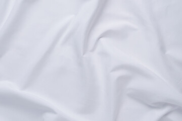 White fabric. luxurious white fabric texture background. Creases of satin, silk and cotton.