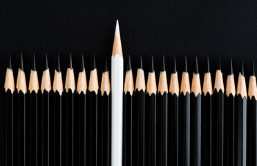 White pencil standing out from the crowd