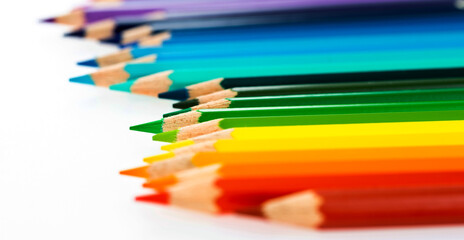 A row of colorful pencils on white background
