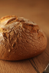 A loaf of rye bread in low key