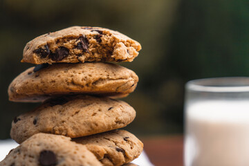 Pile of cookies with a half eaten on top