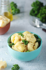 A bowl with Italian dumplings - tortellini