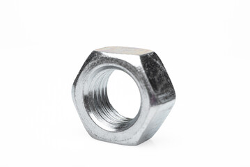 One steel nut. On an isolated white background. With scratches. Close-up studio macro photography.