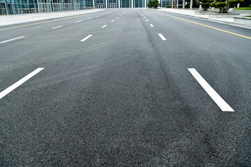 Asphalt road with white dashed lines