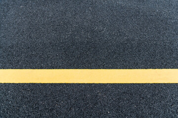 Asphalt road with yellow line