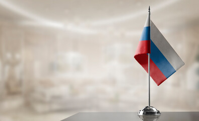 A small Russia flag on an abstract blurry background