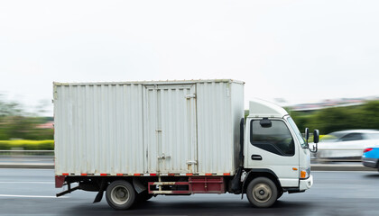 White truck driving on the highway