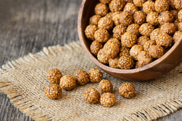 Sesame coated chickpeas with honey and molasses, traditional turkish nut, leblebi