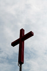 A cross under the cloudy sky