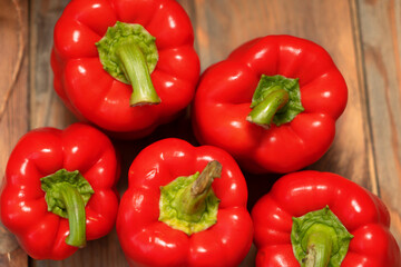 Red peppers on a wooden background