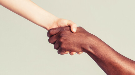 Woman and african woman hand. Helping hand, Rescue, multiathnic people. Helping hands, Rescue gesture