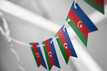 A garland of Azerbaijan national flags on an abstract blurred background