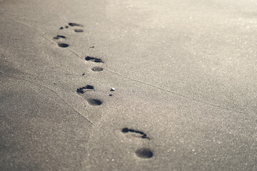 Fototapeta na wymiar footprints in the sand, background