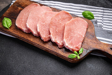 raw pork meat cut slice steak fresh meal food snack on the table copy space food background rustic...