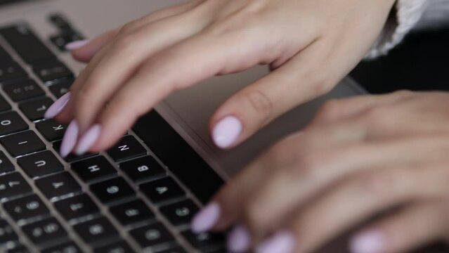 laptop keyboard, women's hands type text, text typing, static frame, close-up, camera panning movement