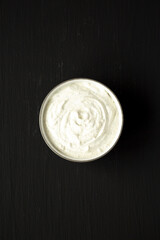 Homemade Ranch Dressing in a Bowl on a black background, top view. Flat lay, overhead, from above.