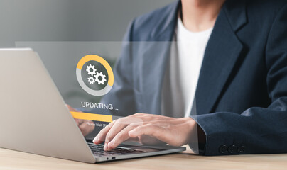 Businessman working and Installing update process. Software update or operating system upgrade to...