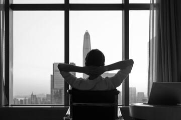 Businesswoman sitting in front of the window