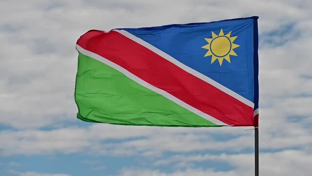 Closeup view of a Namibian flag waving in the wind