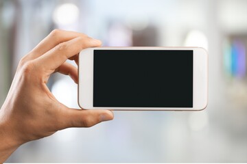 Hand hold phone with a blank screen