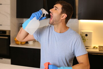 Man pretending to drink cleaning product 