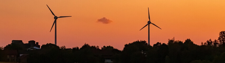 Beautiful sunset with wind power plant silhouettes near Kugl, Simbach, Landau, Isar, Bavaria,...