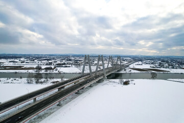 Macharski Bridge over the river Vistula winter time, snowy day, expressway S7, Nowa Huta, Krakow,...