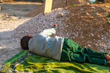sad orphan children weeping at their mother's grave