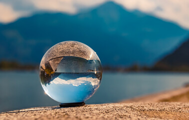 Crystal ball alpine landscape shot at the famous Zeller See lake, Zell am See, Salzburg, Austria