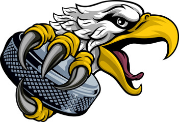 An eagle or hawk ice hockey puck cartoon sports team mascot - obrazy, fototapety, plakaty