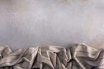 Background with kitchen runner, towel or napkin on grey concrete