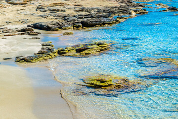 Amazing crystal clear water of Manganari beach, Ios Island,  Greece