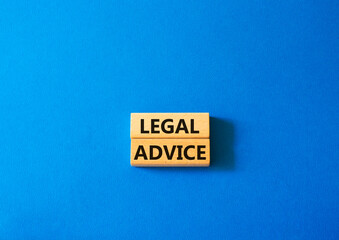 Legal advice symbol. Wooden blocks with words Legal advice. Beautiful blue background. Business and Legal advice concept. Copy space.