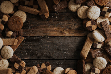 Various biscuits on wooden background