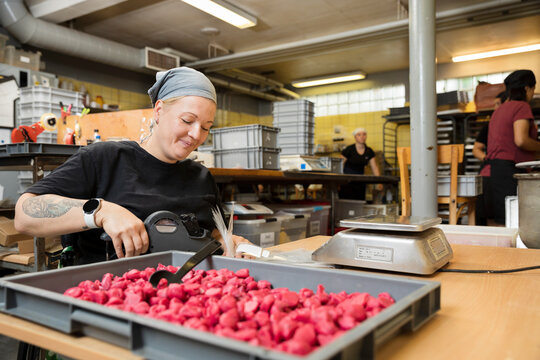 Disabled woman working in food factory