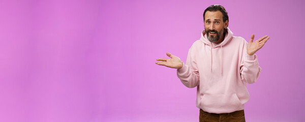 So what bite me. Portrait ignorant careless cool stylish mature bearded man earring pink hoodie...