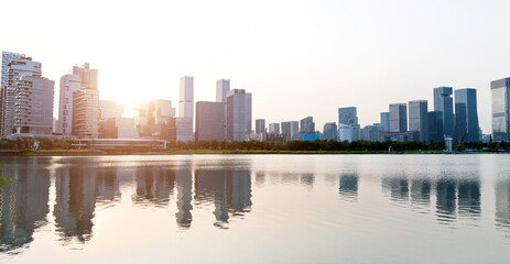 Office building reflected in the water at sunset