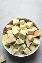 Raw yam in a white bowl, cubes of raw yam, nigerian white yam