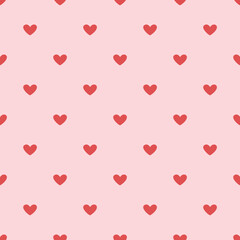Vector valentines day seamless pattern with red hearts on pink background