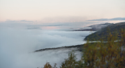 foggy mountain scenery and morning mist during sunrise. landscape and fall concept.