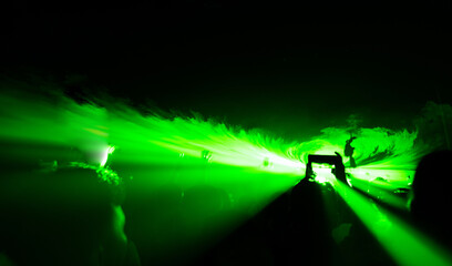 Crowd and blurred green light