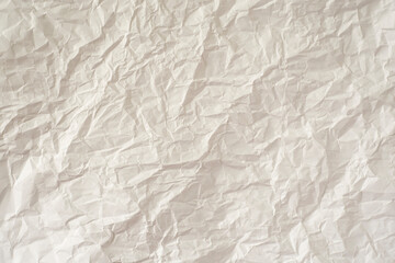 Crumpled white paper as a background.