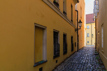 Fototapeta na wymiar Narrow city street of European tourist cozy city. Background with selective focus and copy space