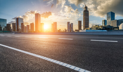 Asphalt road and modern city skyline with buildings in Ningbo, Zhejiang Province, China. © ABCDstock
