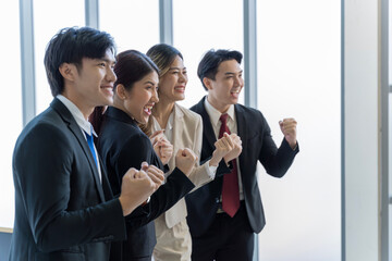 A group of young Asian businessmen Talking and planning work happily and have fun. at the company's office